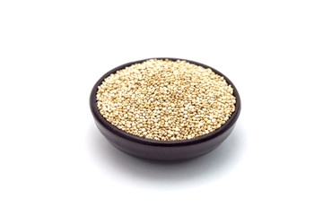 Ceramic bowl with healthy quinoa seeds isolated on white