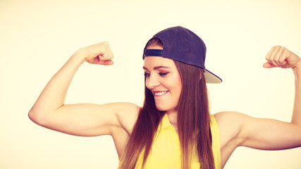 Woman casual style showing off muscles biceps