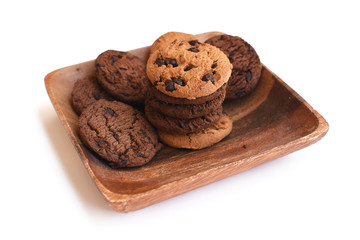 Chocolate chip cookies on wood plate