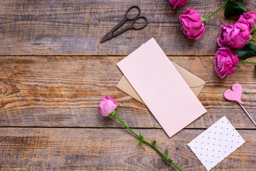 Spring design with peony flower and greeting-card wooden background top view mock-up