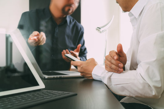 co working team meeting concept,businessman using smart phone and digital tablet and laptop computer in modern office