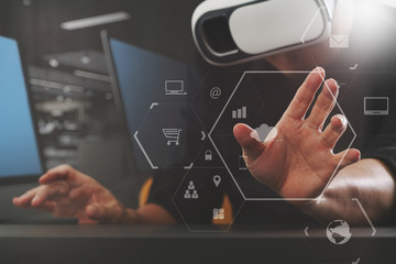 businessman wearing virtual reality goggles in modern office with mobile phone using with VR headset with screen icon diagram
