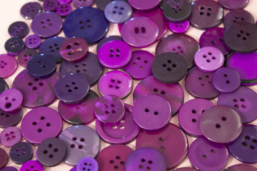 Purple sewing buttons background