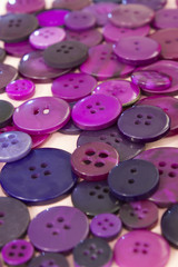 Purple sewing buttons background
