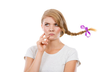 Teenage girl in braid hair making thinking face