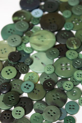 Green sewing buttons background