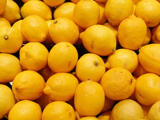 Colorful Display Of Lemons In Market