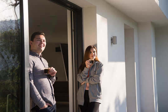 couple enjoying on the door of their luxury home villa