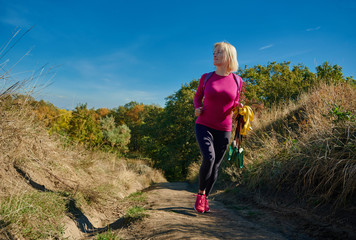Fototapeta premium Athletic woman on the pathway