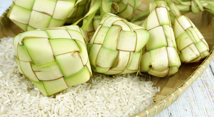 Ketupat and rice in bamboo containers