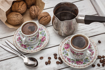 Two cups of coffee.