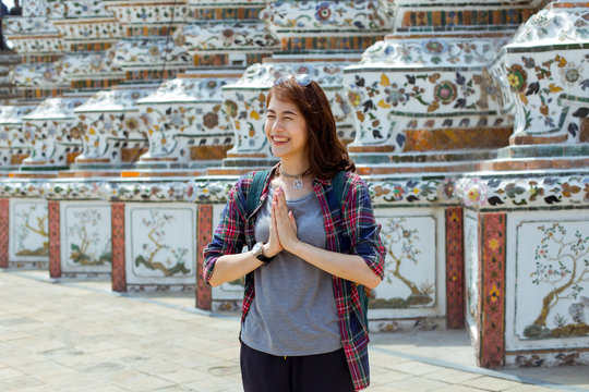 A young lady worship at Wat Po, Thailand