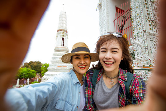 Girlfriends take a selfie at Wat pho in Thailand