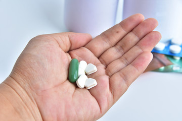 hand holding medicine.