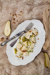 Pear with blue cheese sauce and nuts