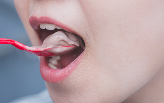 Close Up A Girl Eating Chocolate Flavour Ice Cream