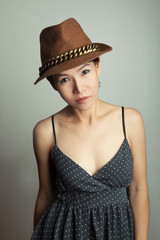 Stylish asian woman in hat 