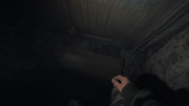 Point of view man with flashligh look arond in dark empty room inside scary abandoned building, open door with force post apocalyptic war scavenger stalker, lots of trash