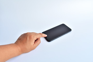hand touch black smartphone on white background.