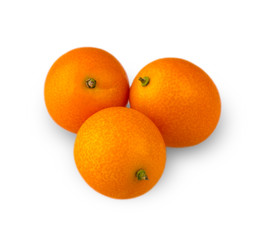 Three delicious kumquat, carved on a white background.