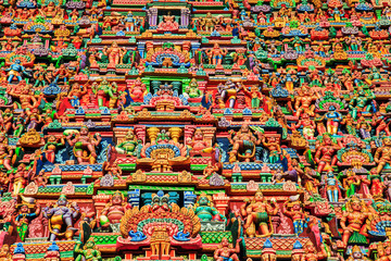 Fototapeta premium Colorful carved walls of the Indian temple.