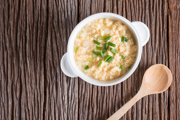 Egg drop soup in white bowl. Top view.