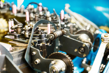 Fototapeta na wymiar The mechanism of a braiding machine close-up.