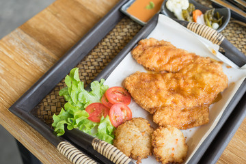 Breast chicken fried with fried rice sushi.