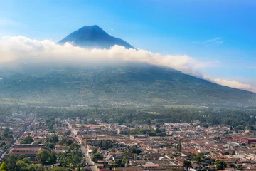 Foto auf Glas Panoramic view from Cerro de la Cruz on the city of Antigua, Guatemala and Volcano De Agua in the background. © Marek Poplawski