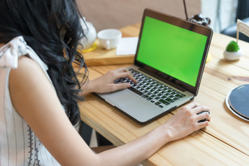 Fototapeta premium Woman use of the laptop computer, Selective focus, focus too soft.