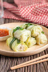 Cabbage stuffed with meat on plate.