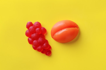 Lemon and banana sweet marmalade candy on pink background