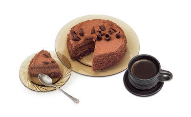 Partly sliced chocolate cake and black coffee