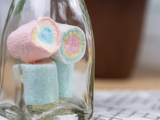 Close up of colorful candy in a clear bottle