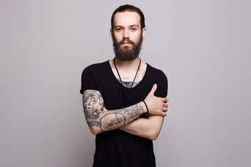 bearded man with tattoo