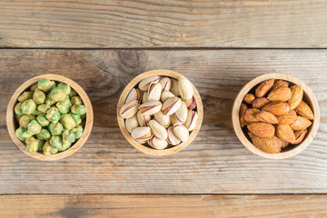 Pistachio, Green nut, Almond in cup wood, Top view.