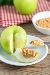 Green apple with peanut butter.