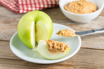 Green apple with peanut butter.