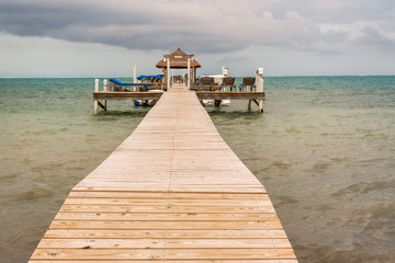 Wooden pier dock and ocean view at Caye caulker Belize Caribbean.