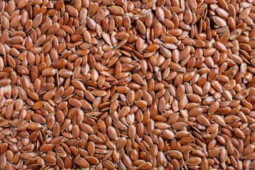 Brown organic flax seeds food background