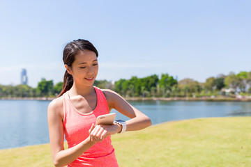 Woman using smart watch and ready for running
