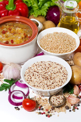 brown rice and quinoa and fresh ingredients for soup, vertical closeup