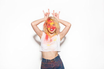 Cheerful girl in paint