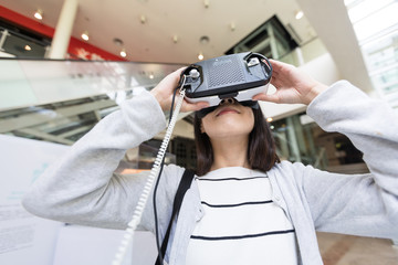 Woman looking with VR device