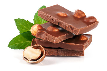 Chocolate with hazelnut and mint leaf isolated on white background