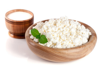Cottage cheese in a wooden bowl isolated on a white background