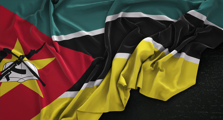 Mozambique Flag Wrinkled On Dark Background 3D Render