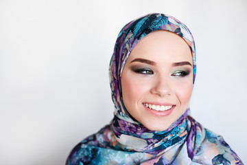 woman in colorful headscarf. colorful makeup