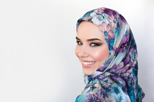 woman in colorful headscarf. colorful makeup