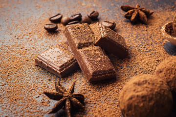 Chocolate truffle,Truffle chocolate candies with cocoa powder.Homemade fresh energy balls with chocolate.Gourmet assorted truffles made by chocolatier.Chunks of chocolate and coffee beans